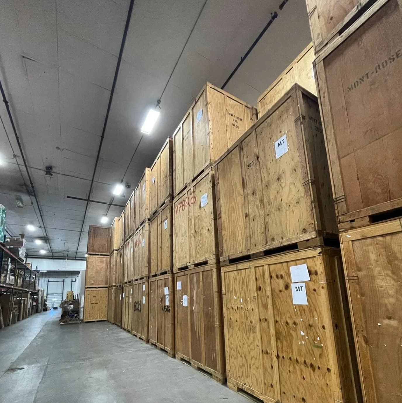 Wooden storage vaults stacked in a warehouse for secure storage solutions in Salt Lake City