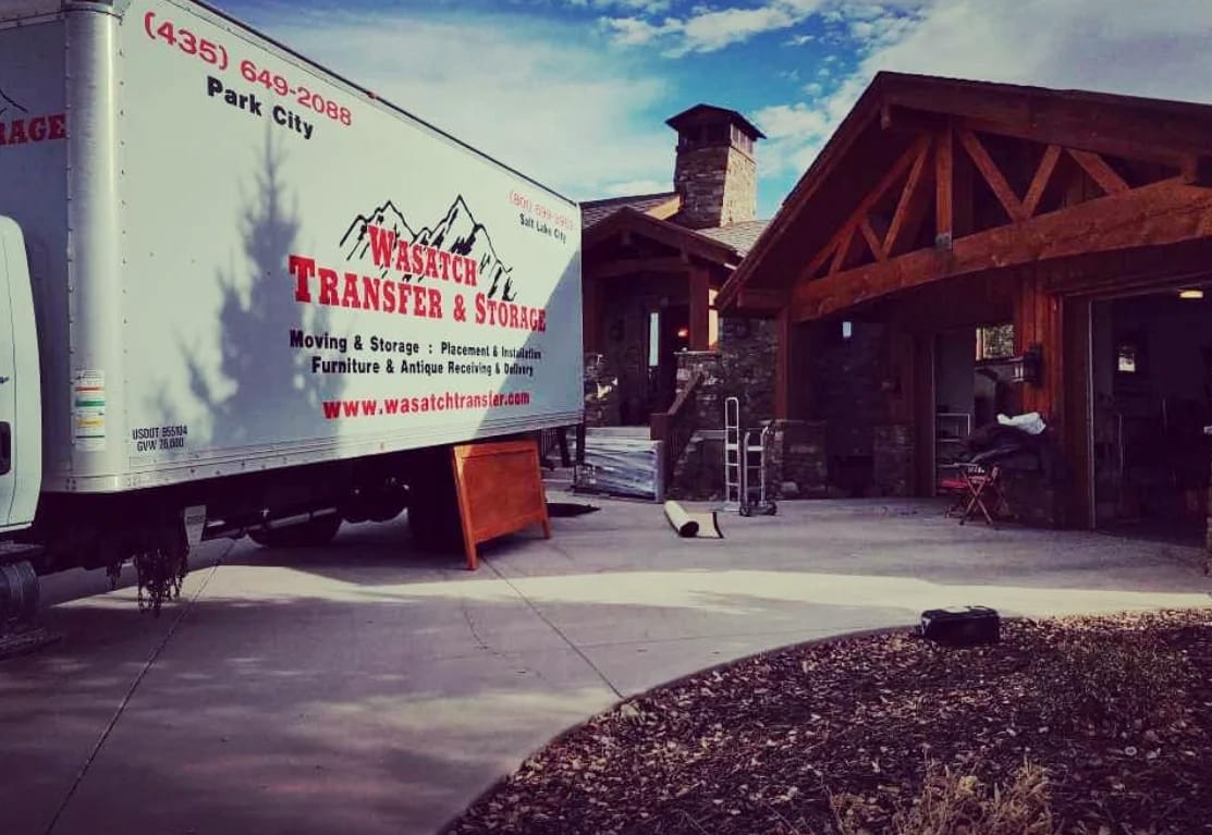 Wasatch Transfer moving truck and crew unloading at a property on a short-notice move
